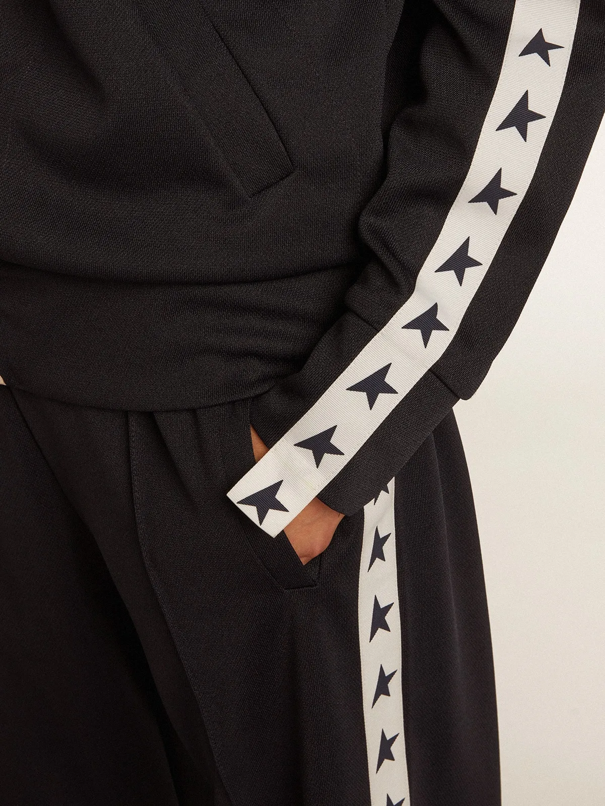 Dark blue joggers with white strip and contrasting stars